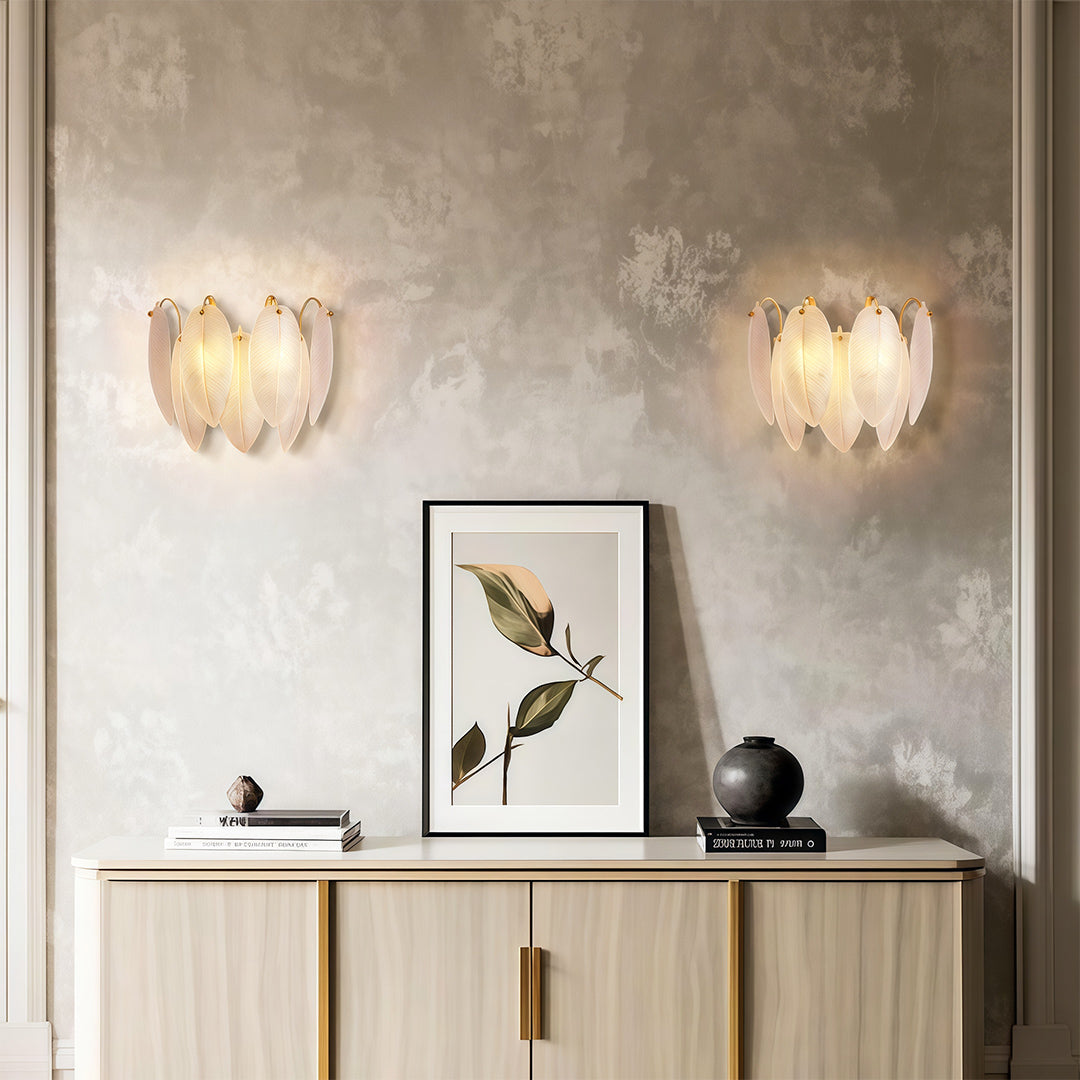 Modern luxury chandeliers style feather wall light pair flanking console table with artwork