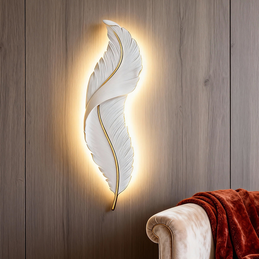 Modern feather wall light glowing warm white on wooden accent wall in living room.