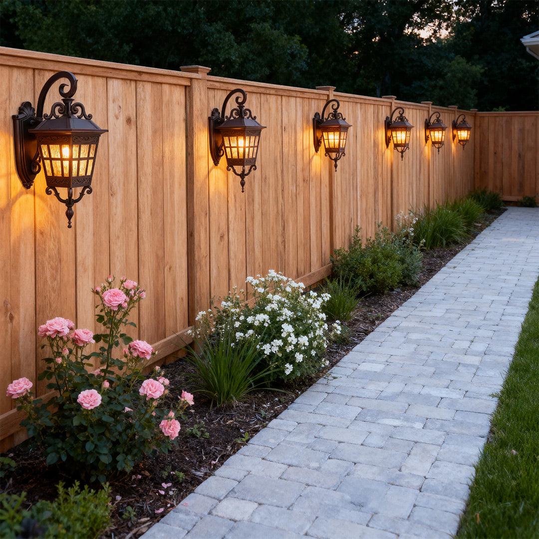 Outdoor patio wall lights illuminating a fence, warm and inviting exterior lighting fixtures