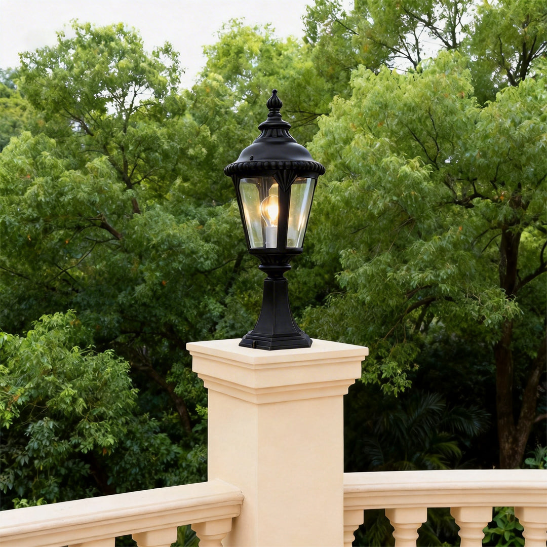 Fence pillar lights mounted on a tall cream pillar, creating a classic outdoor terrace accent.