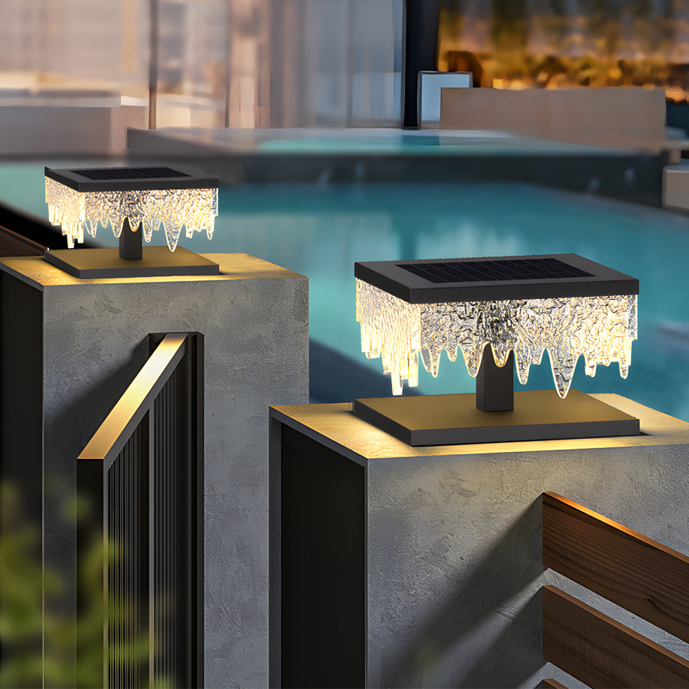 Fence pillar lights enhancing a garden pathway with modern, sleek design.