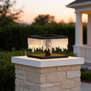 Fence pillar lights illuminating a modern garden pathway with warm, ambient glow.