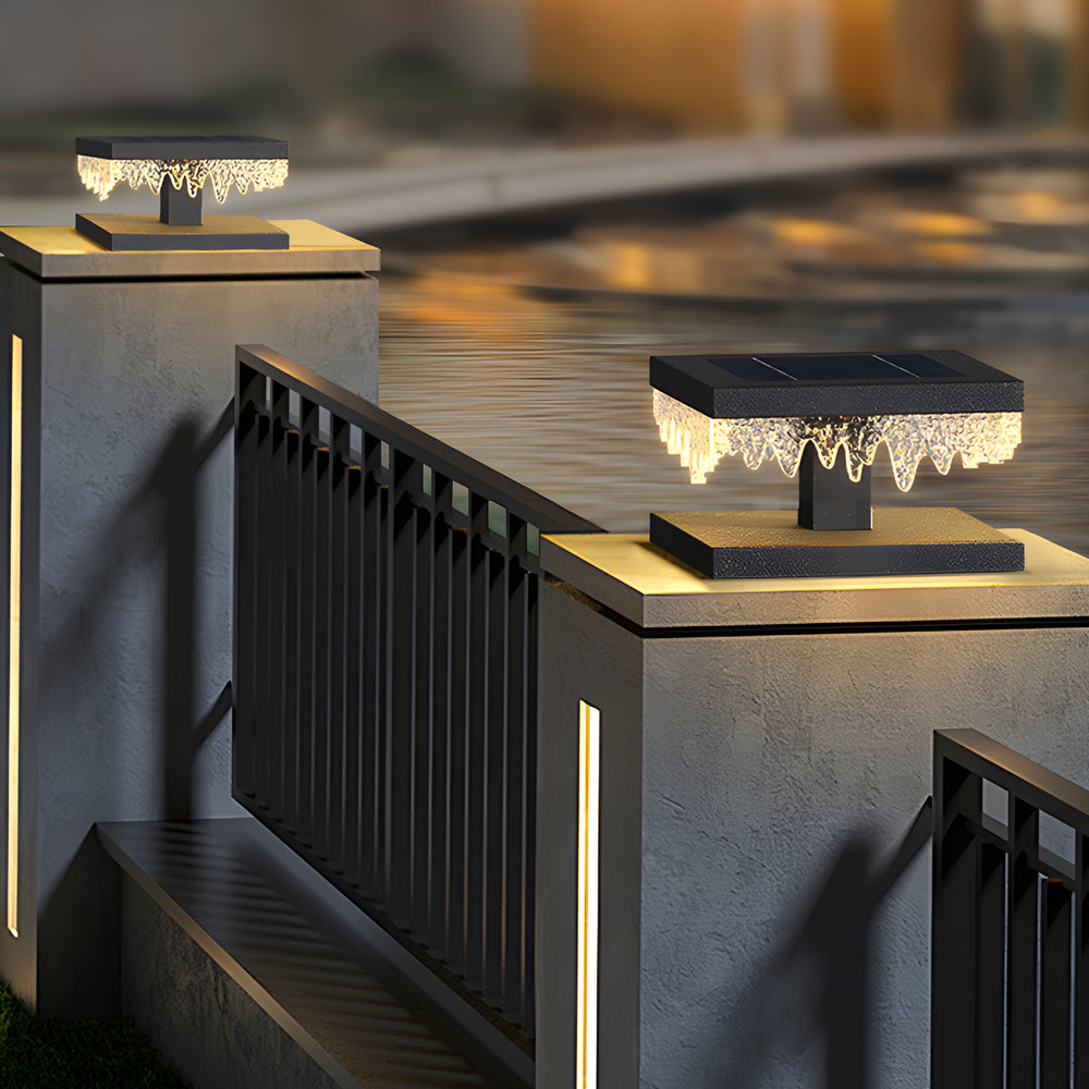 Fence pillar lights enhancing a stylish fence with elegant, geometric design.
