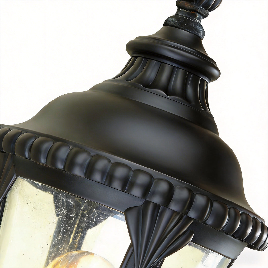 Fence pillar lights close-up showing the top cap and decorative trim of the lantern fixture.