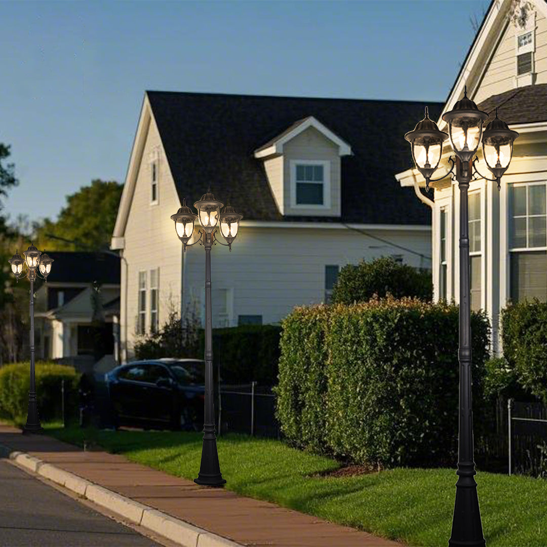 Victorian street lamp illuminating suburban neighborhood with modern houses and driveways