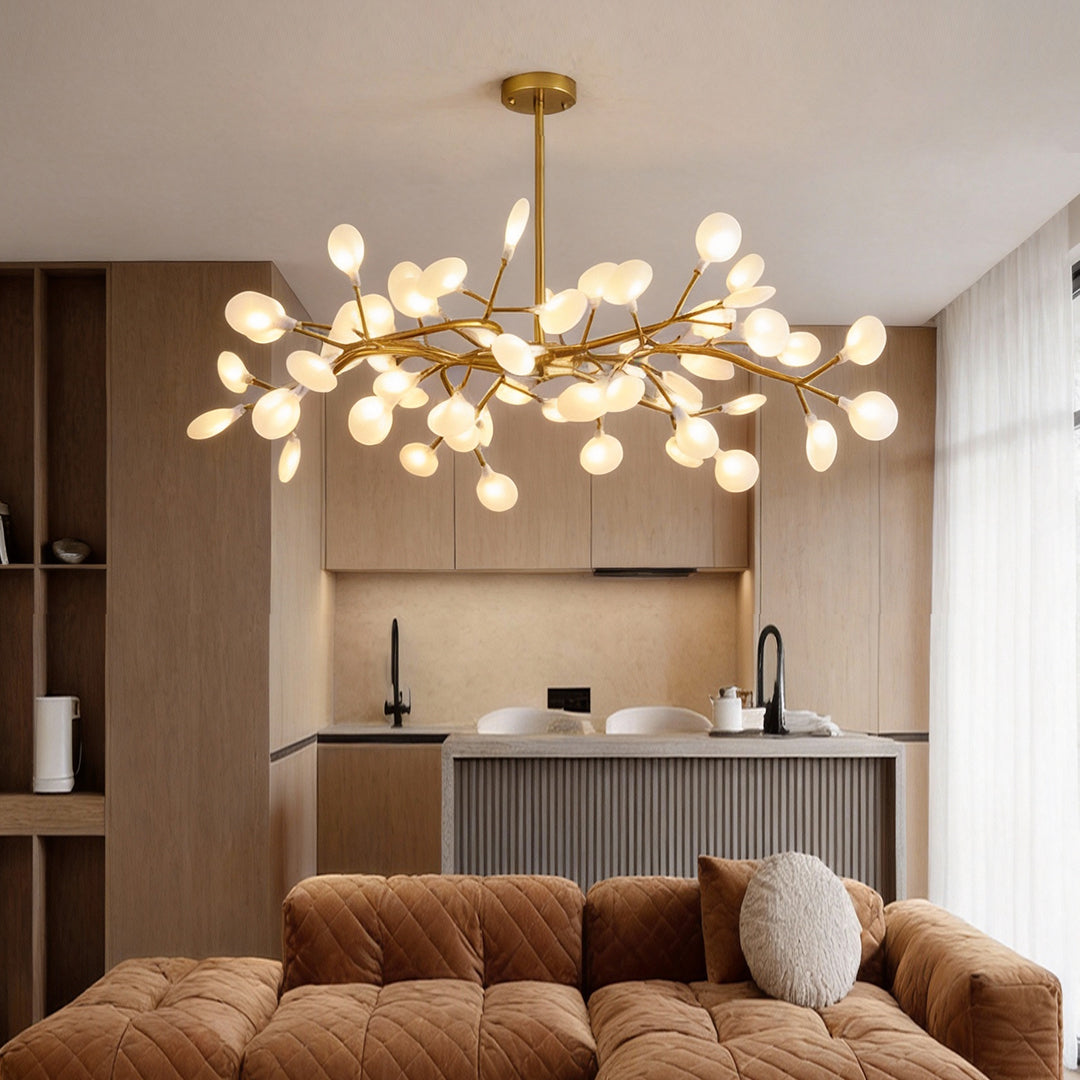 Firefly pendant light above sectional sofa in contemporary living space.