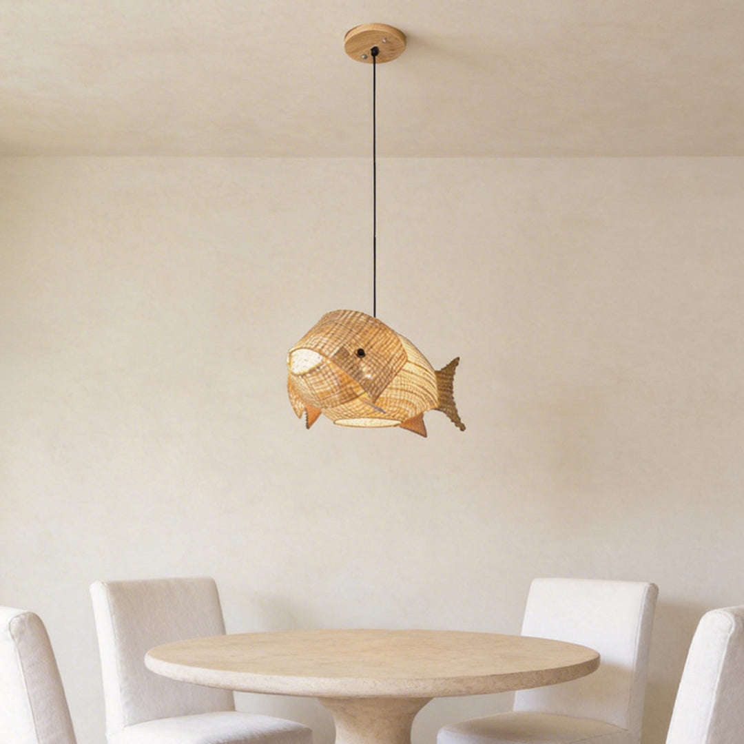 Fish pendant light with a natural rattan finish, illuminating a contemporary kitchen island.