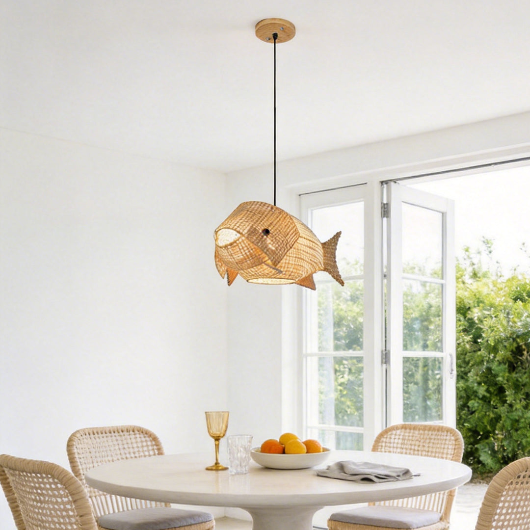 Fish pendant light with a woven design, hanging above a modern dining table.