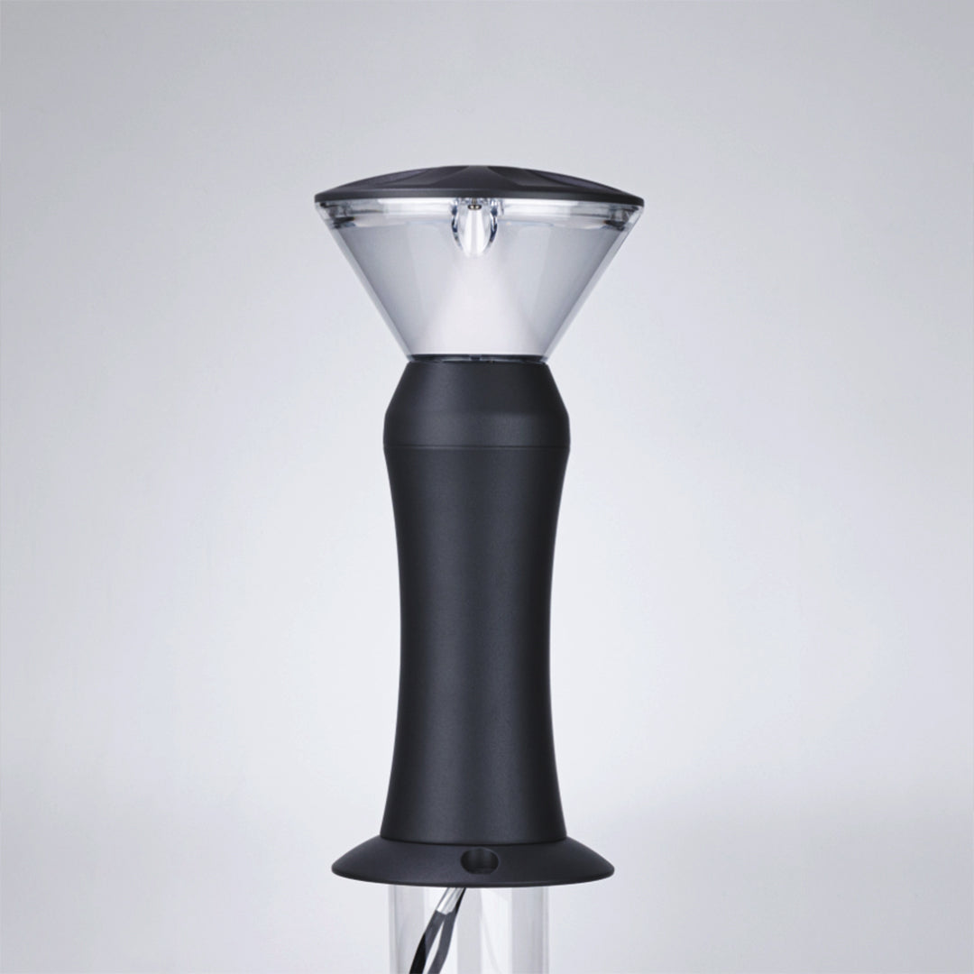 Wide-base black outdoor light with flared bottom and conical top design