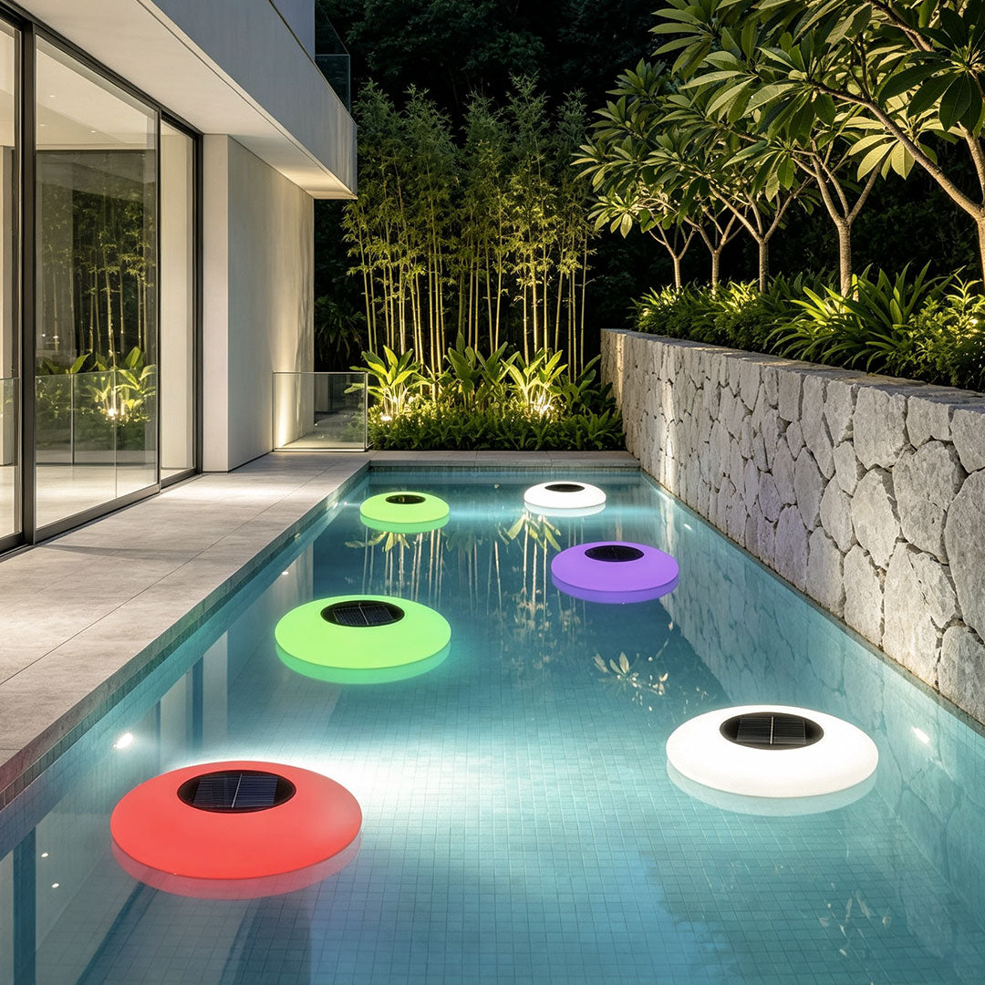 Floating pond lamp set in a narrow pool, showcasing bright multicolor glowing discs for stylish landscape and poolside decoration.