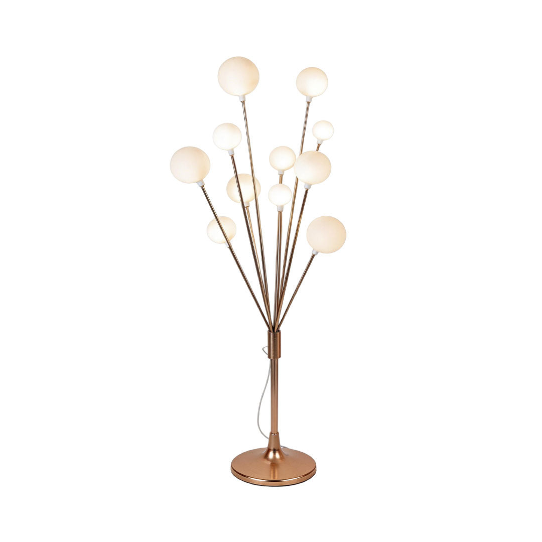 Floor lamp decor with a modern tree design, providing ambient lighting in a living space.
