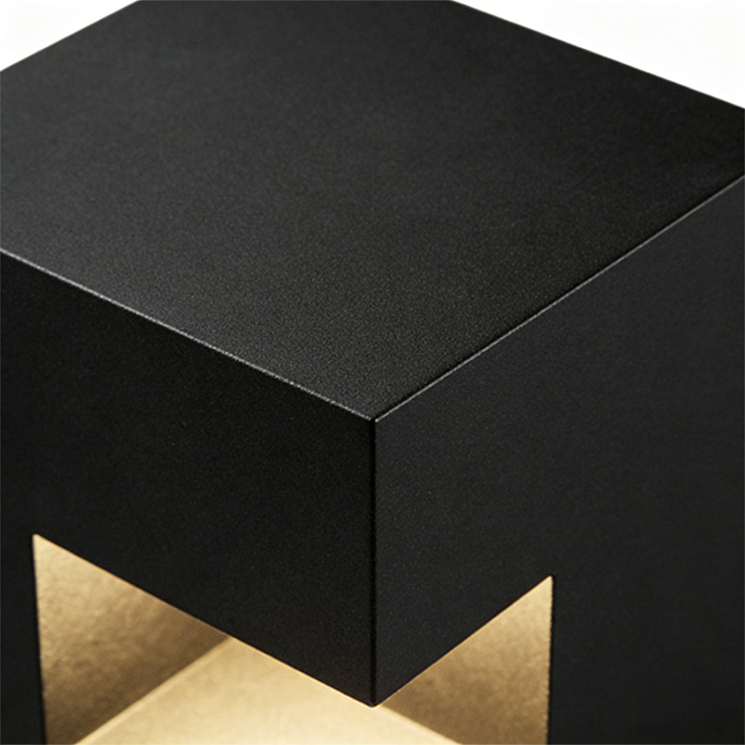 Floor light box with a close-up of its geometric cutout and light.