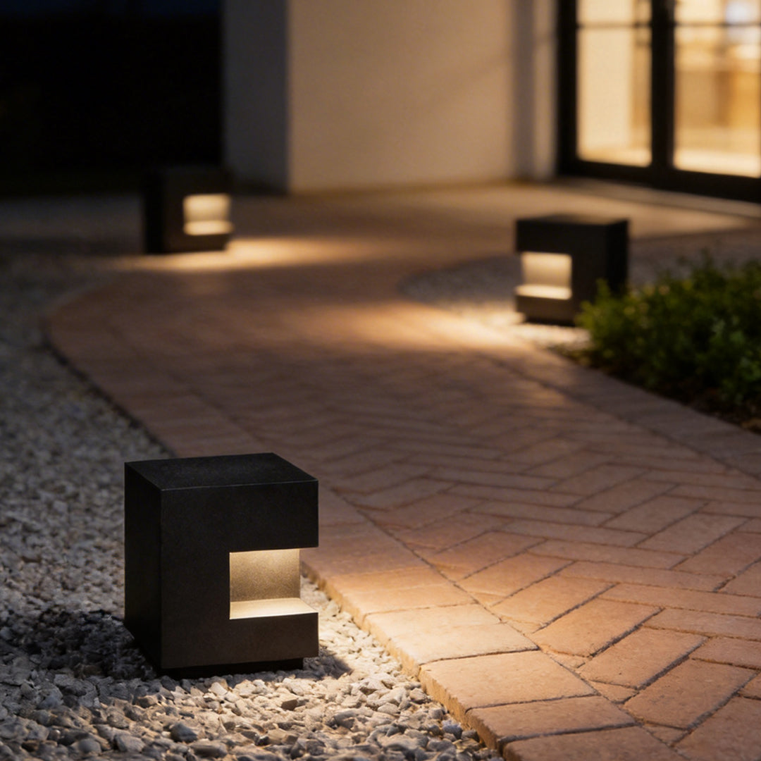 Floor light box enhancing a contemporary outdoor walkway with warm ambient glow.
