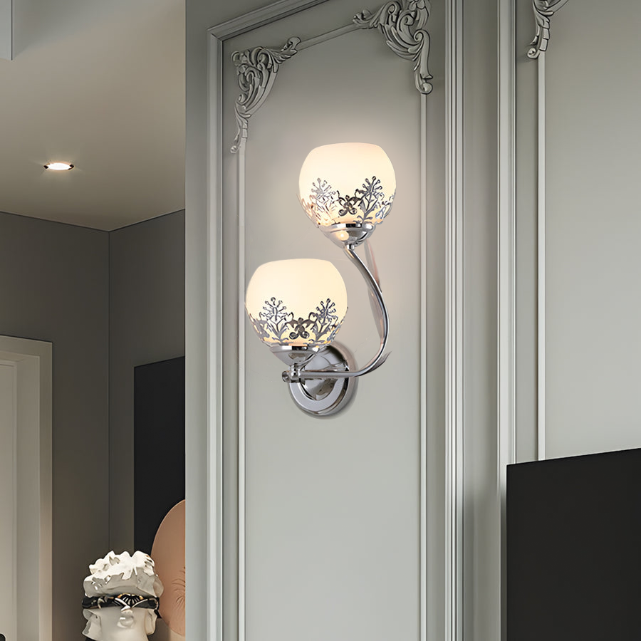 Single floral wall sconce installed in a hallway with classic molding details.