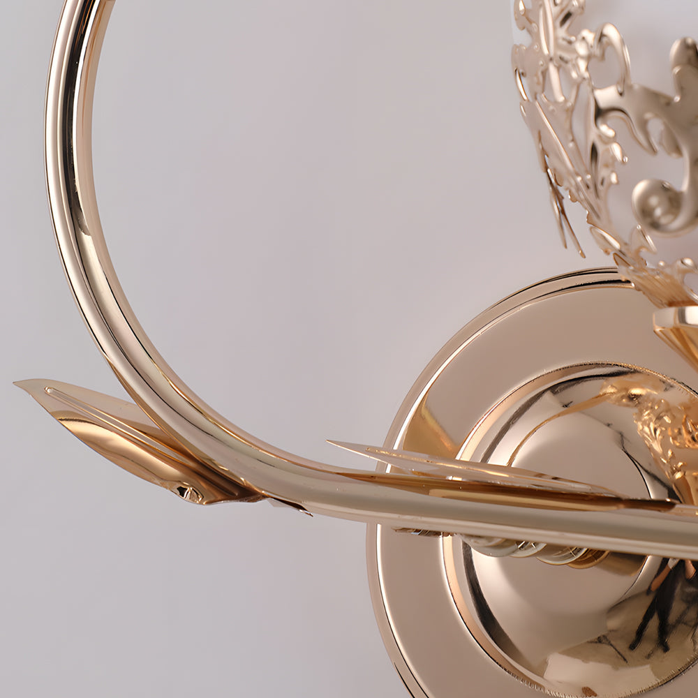 Close-up of floral wall sconce metal arm with leaf-inspired decorative details.