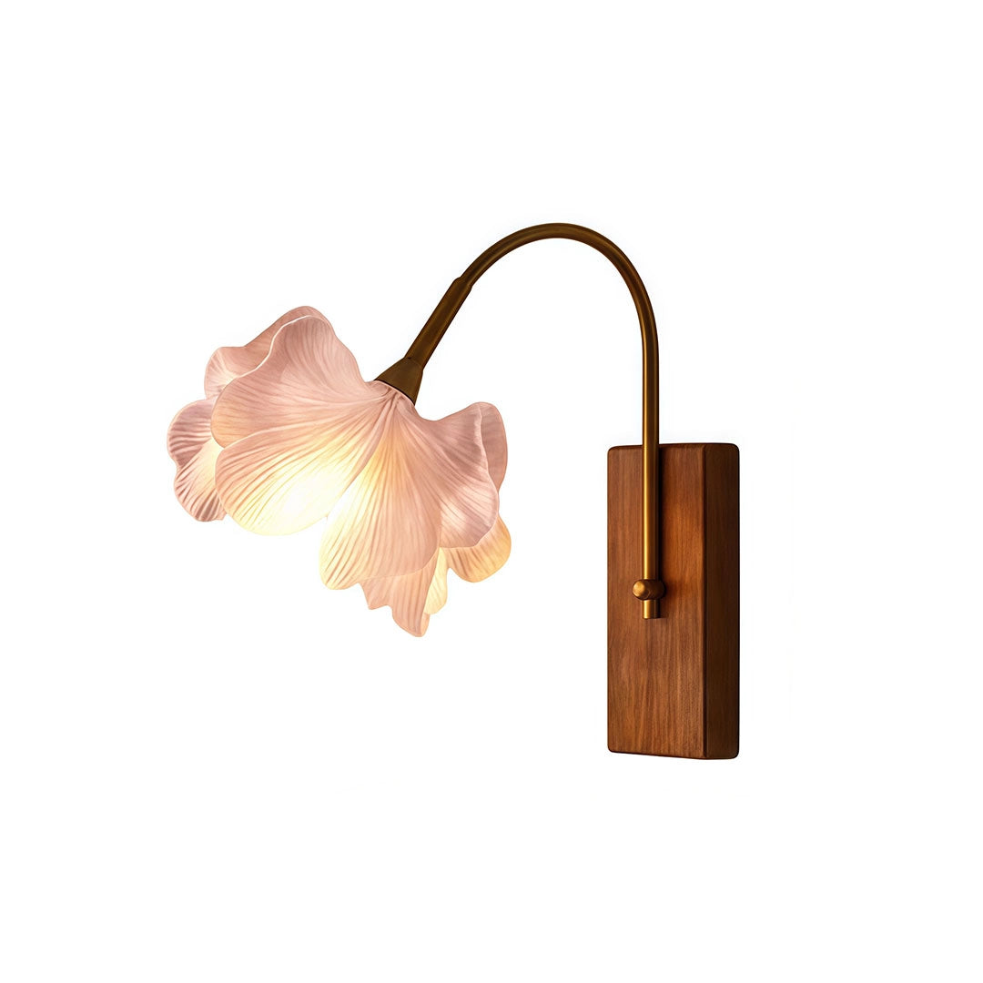Flower wall light product image with a pink floral shade, curved brass arm, and rectangular backplate.