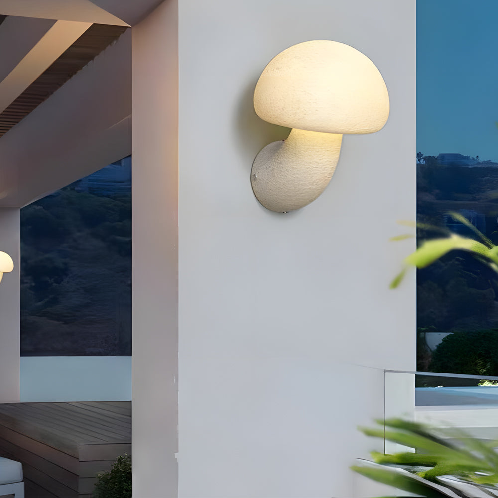 Contemporary LED wall lights with fluid mushroom-like form installed in modern interior space with blue accent wall
