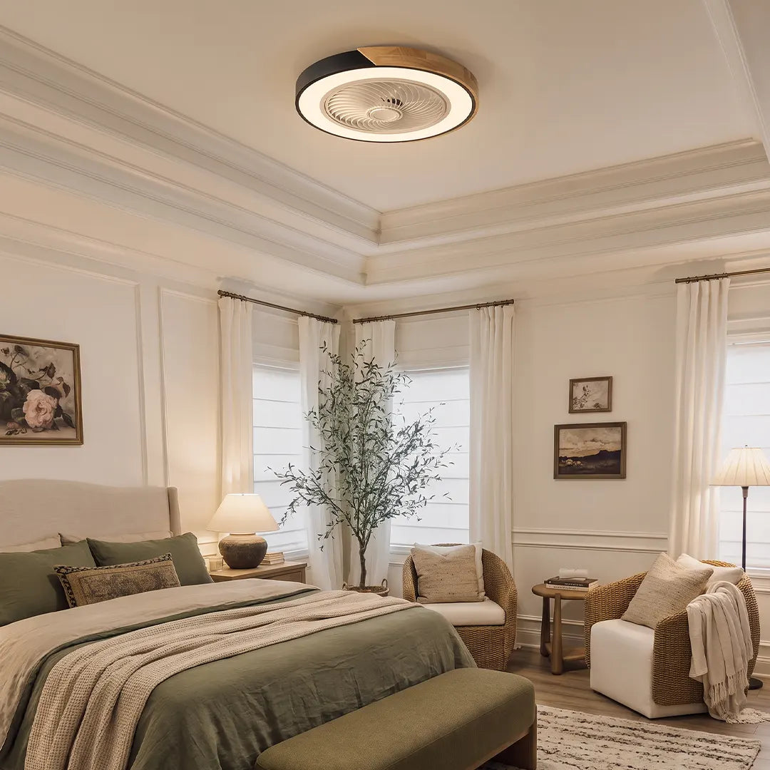Flush ceiling fan with light and remote mounted in an elegant bedroom, combining a compact ceiling-hugging fan with warm integrated illumination.