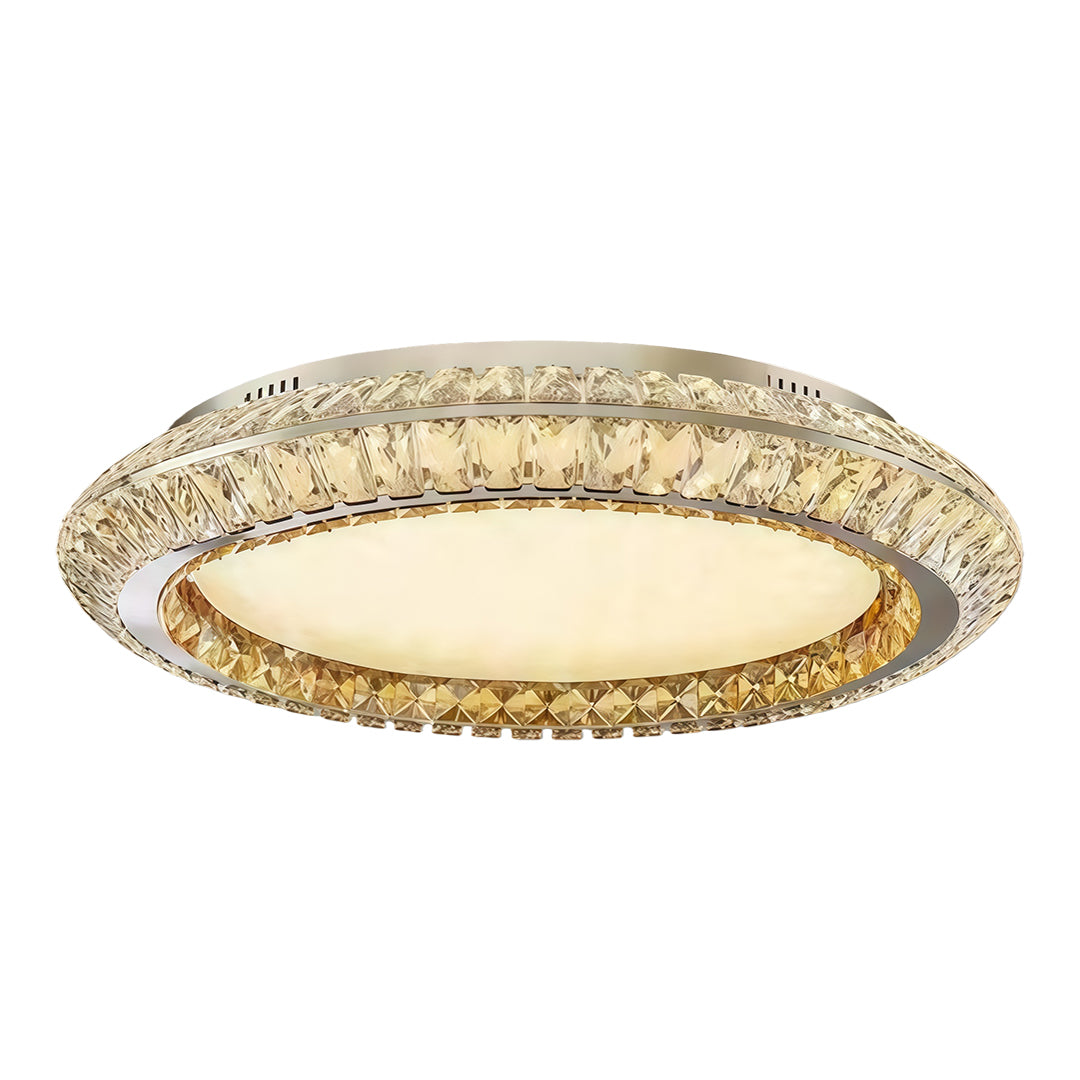 Flush mount crystal ceiling light featuring a round design with a gold frame and crystal accents.