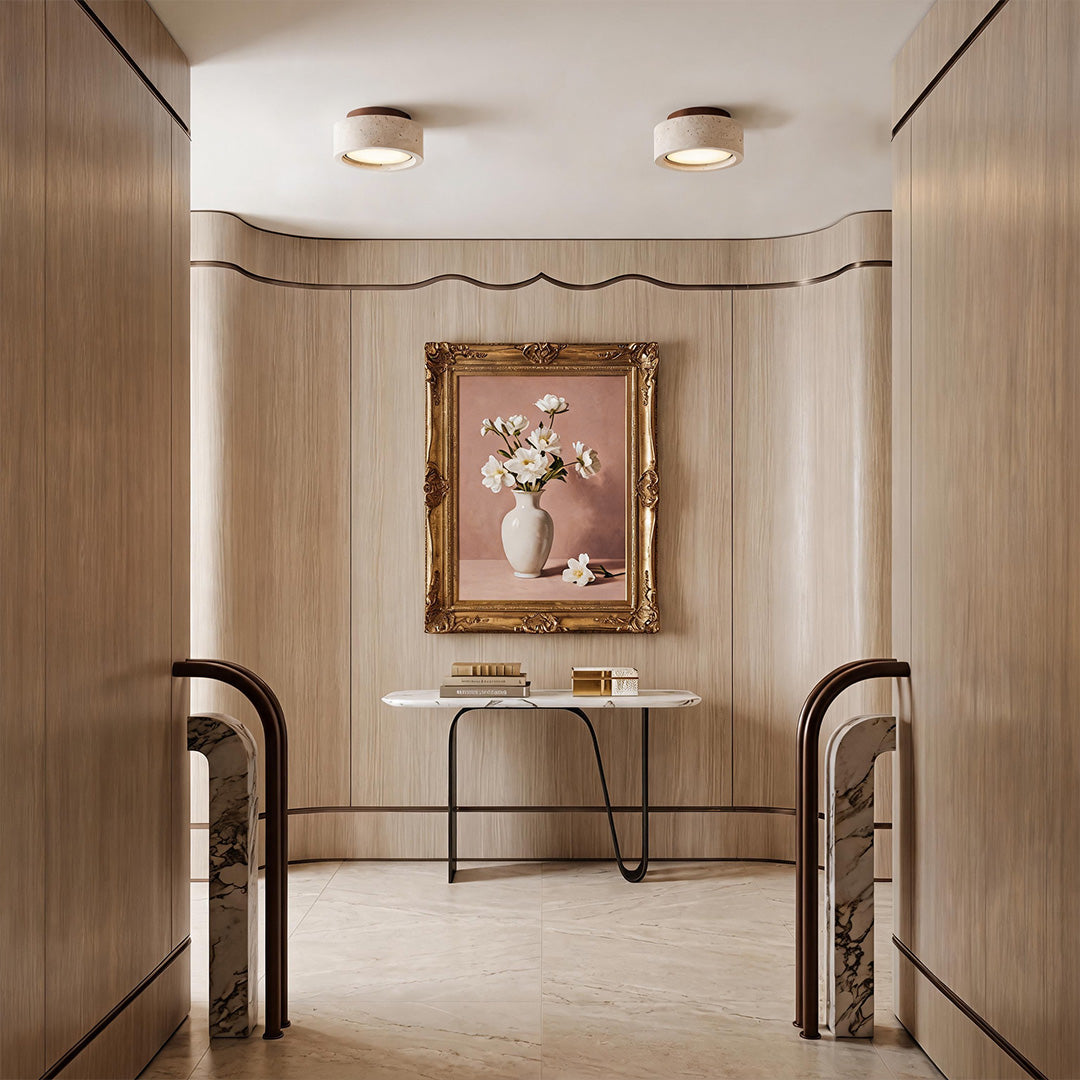 Flush mount entry light installed in a modern foyer with clean architectural interiors.