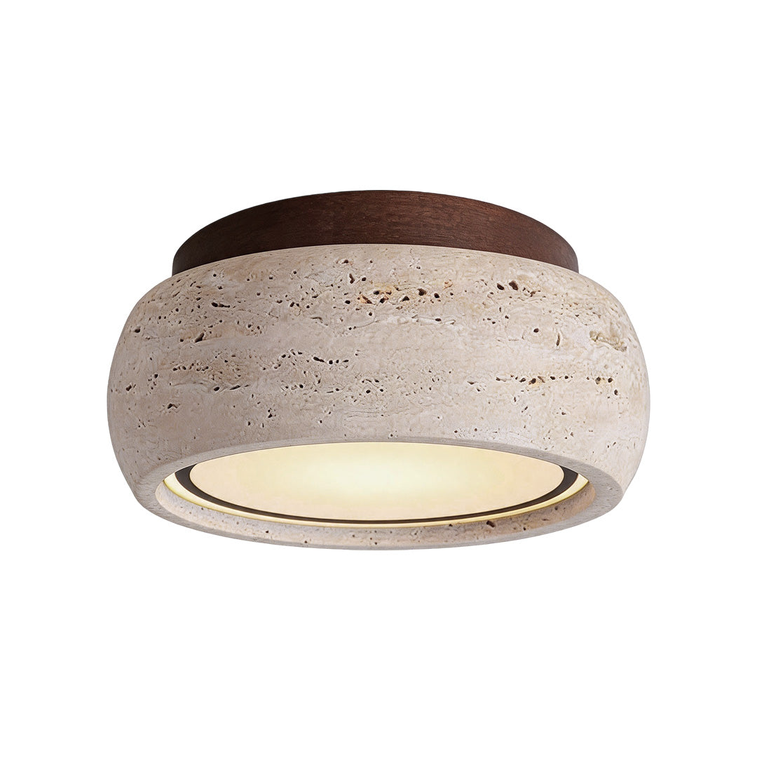 Flush mount entry light with a natural stone finish and warm integrated LED illumination.