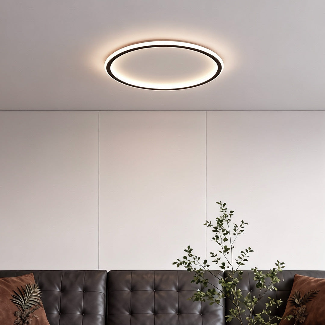 Neutral toned room styled with a flush mount led circle ceiling lamp for even illumination.