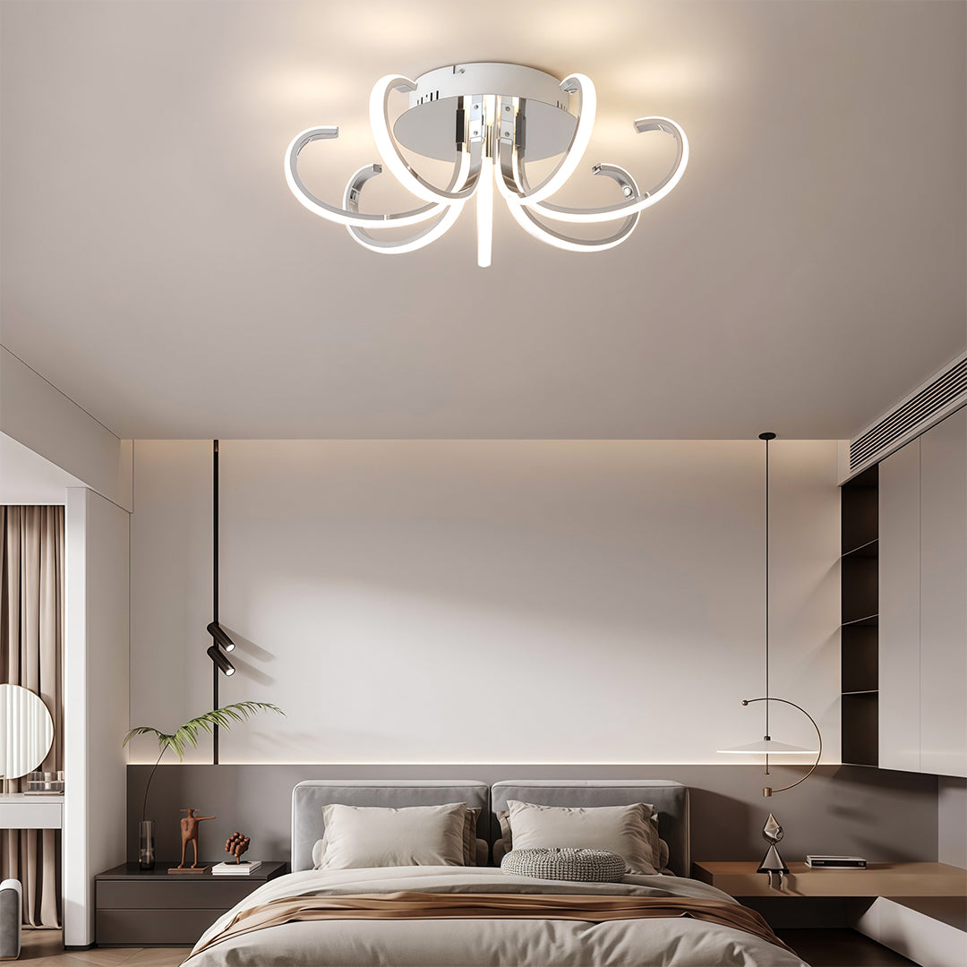 Flush mount led lighting enhancing elegant bedroom with grey upholstered headboard