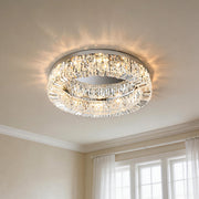 Stunning flush mount modern crystal ceiling light featuring a sparkling ring of rectangular crystal prisms casting radiant light in an elegant room.
