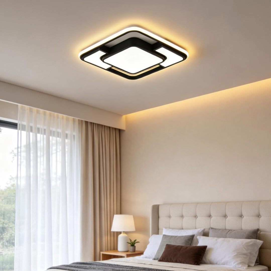 Modern flush mount square ceiling light installed in a minimalist bedroom with warm ambient lighting