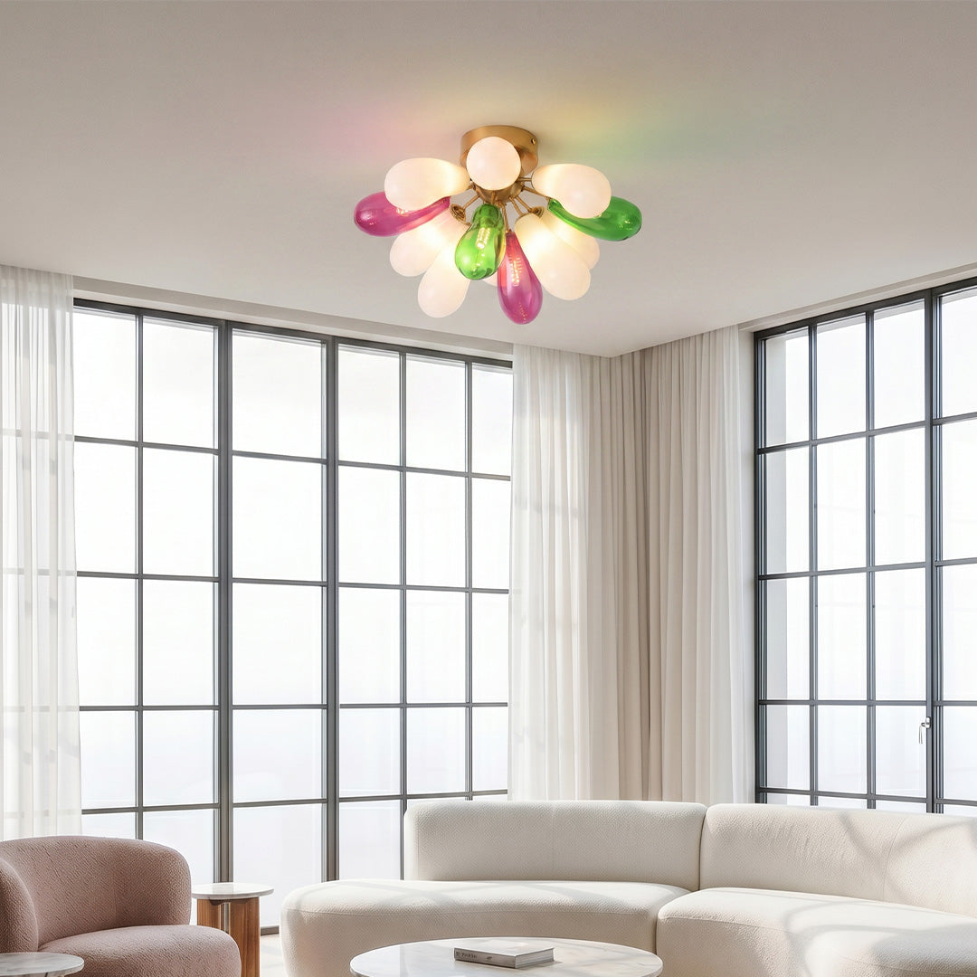 Colorful stained glass flush mount ceiling light installed in a bright living room with large windows and modern decor.