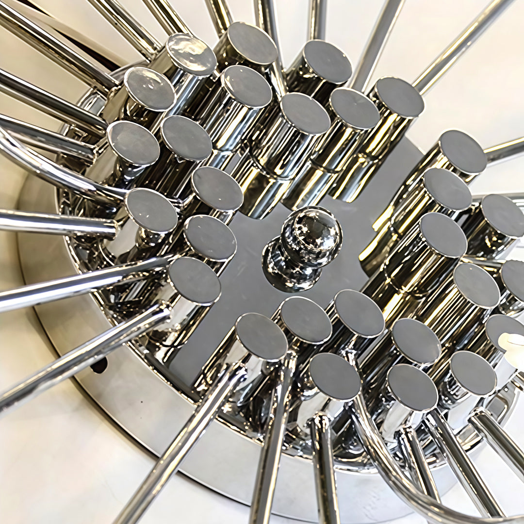 Flush mount starburst light fixture with a close-up of the starburst arms and bulbs.