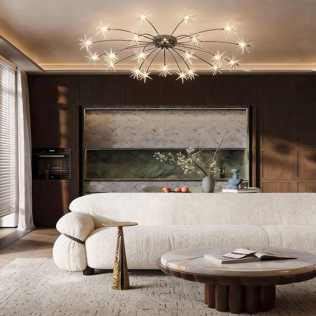 Flush mount starburst light fixture illuminating a modern living room with warm, ambient glow.