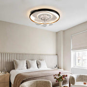 Flush mounted ceiling fan with light illuminating a modern bedroom with warm ambient glow.