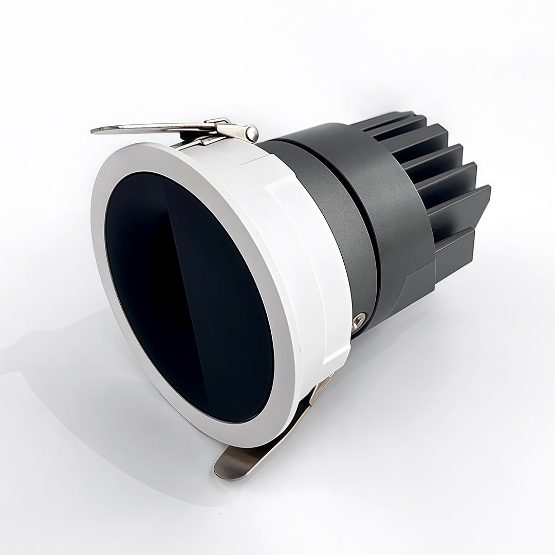 Focused adjustable spotlights with glass shade chandelier aesthetic providing accent lighting in warm-toned architectural space.