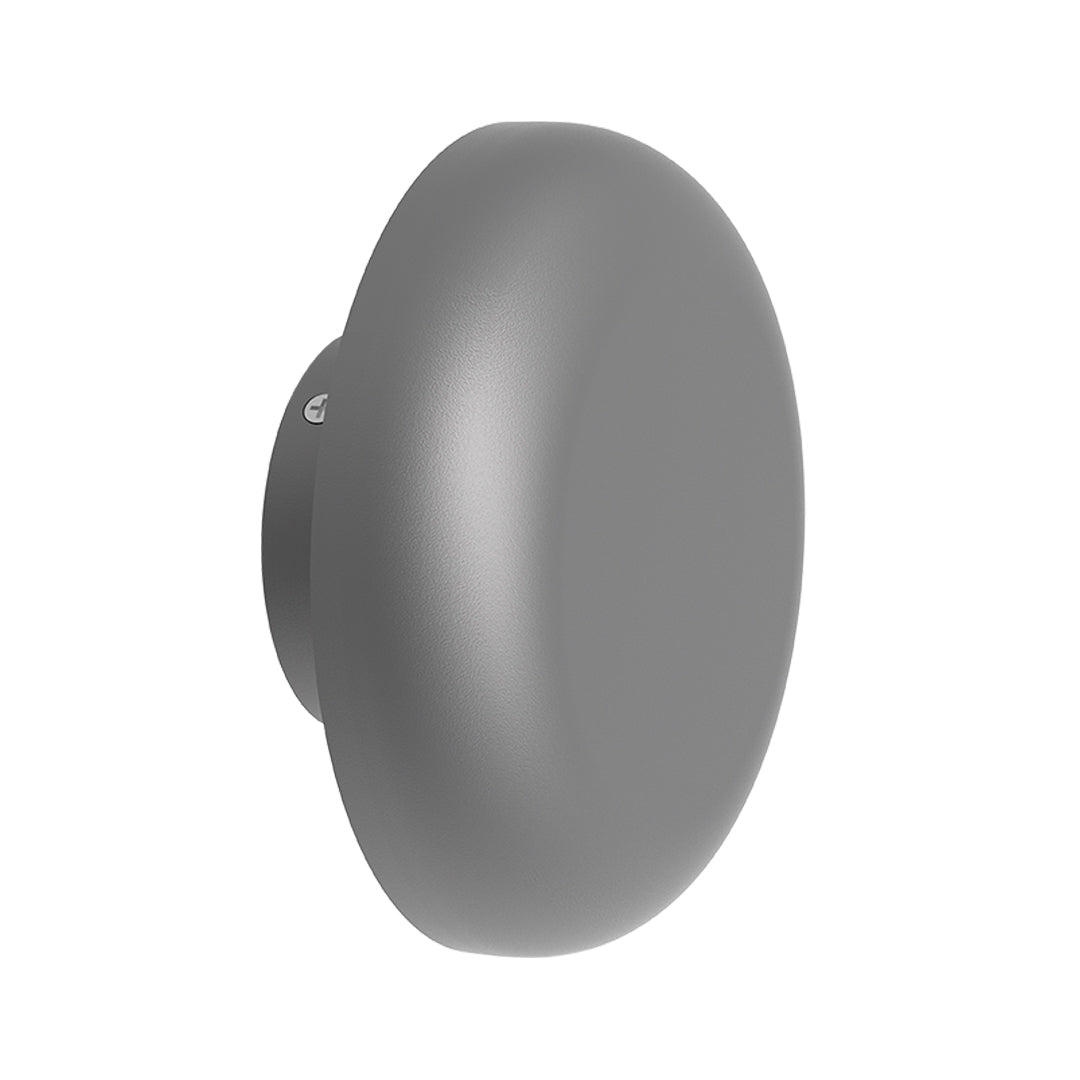 Four round waterproof outdoor wall lights symmetrically arranged on minimalist courtyard walls with trees