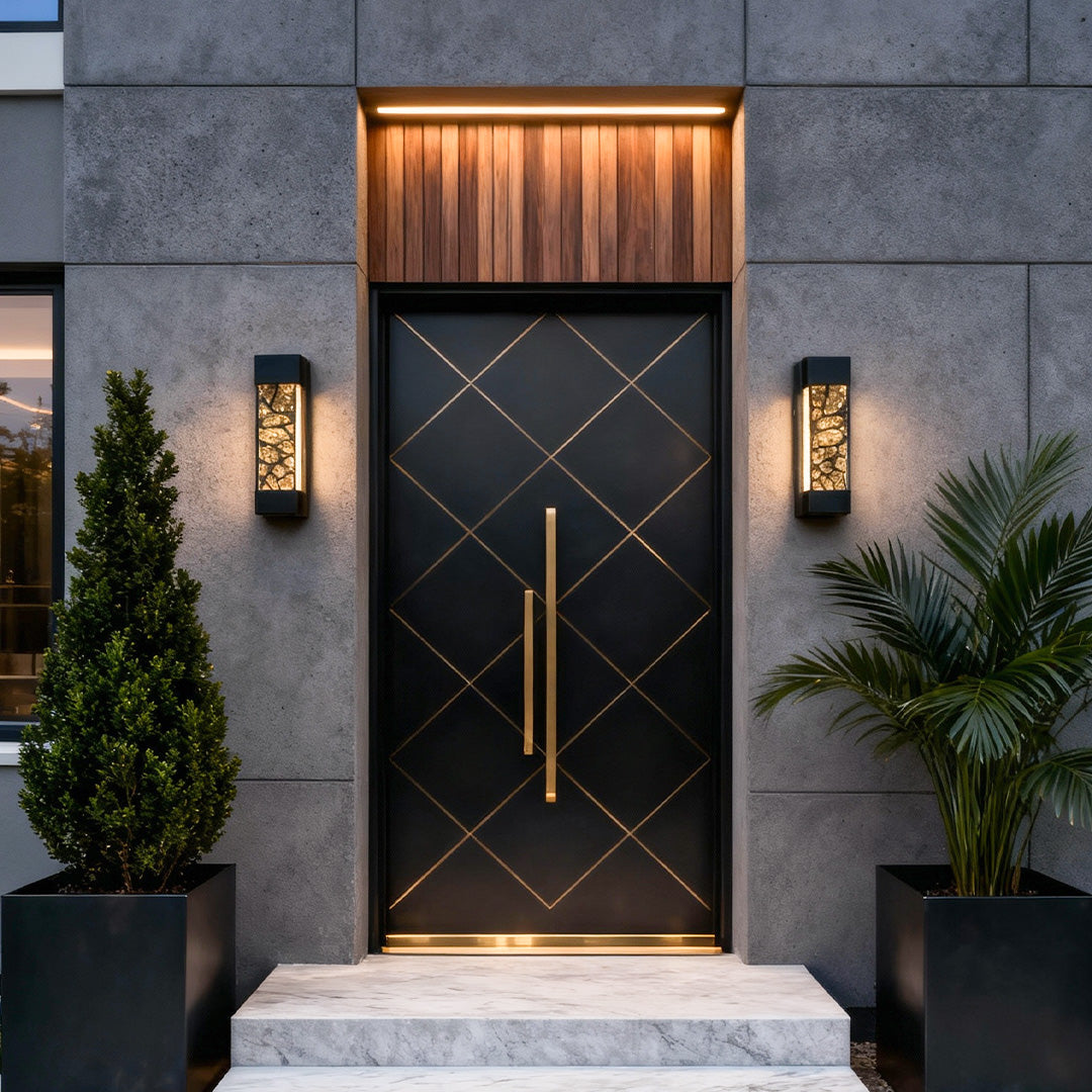 Pair of led linear wall light fixtures flanking a modern front entrance, producing soft warm architectural lighting.