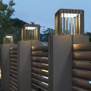 Front pillar lights mounted on horizontal slatted fence pillars for a warm modern exterior look.