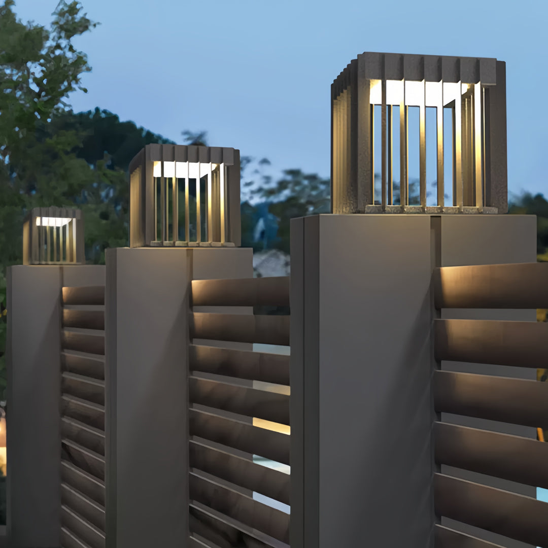 Front pillar lights mounted on horizontal slatted fence pillars for a warm modern exterior look.
