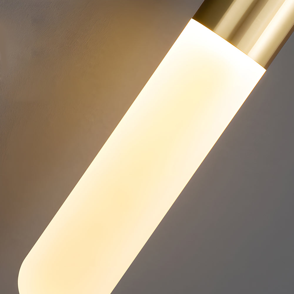 Close-up detail of the glowing frosted glass diffuser on a luxury Gold Capsule Pendant Light.