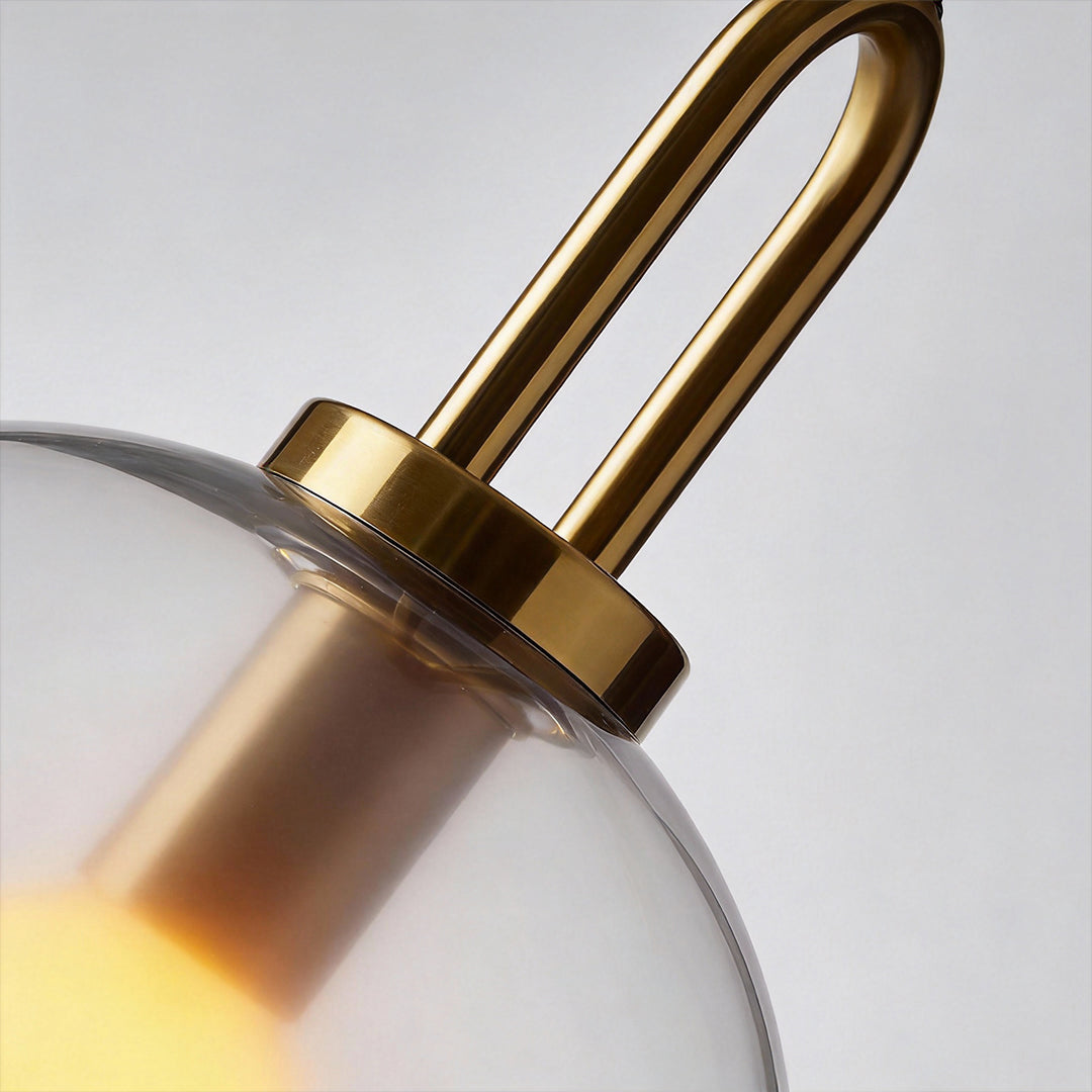 Frosted glass mini pendant light in gold, front view of the modern design.