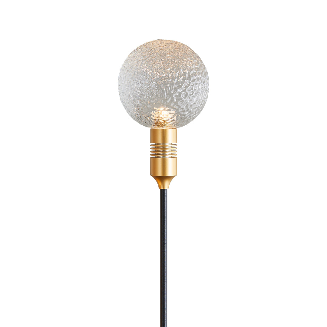 Small frosted crackle-glass globe on a golden stem for elegant path landscape lighting.