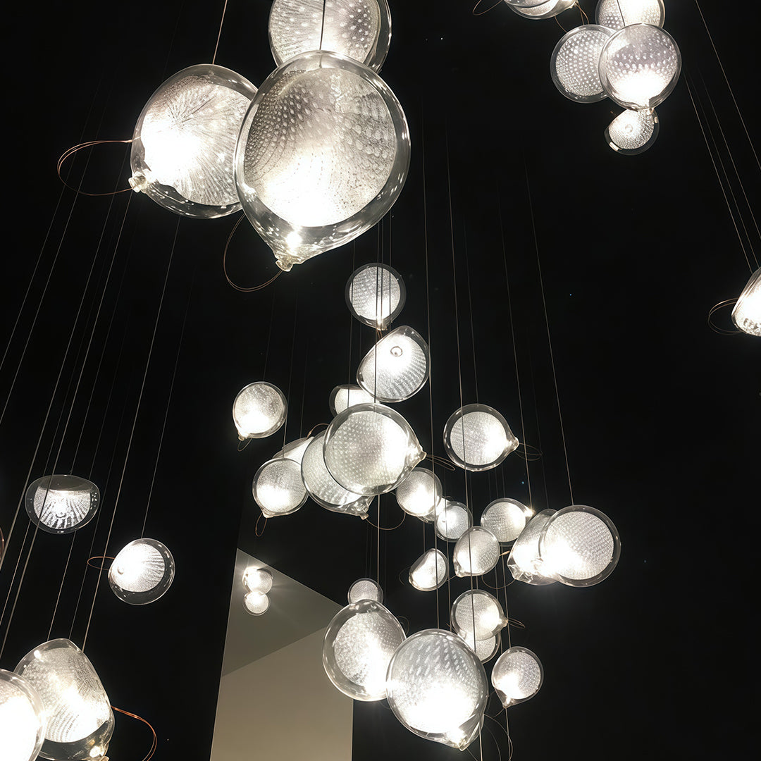 Jellyfish-inspired chandelier in contemporary art gallery interior.
