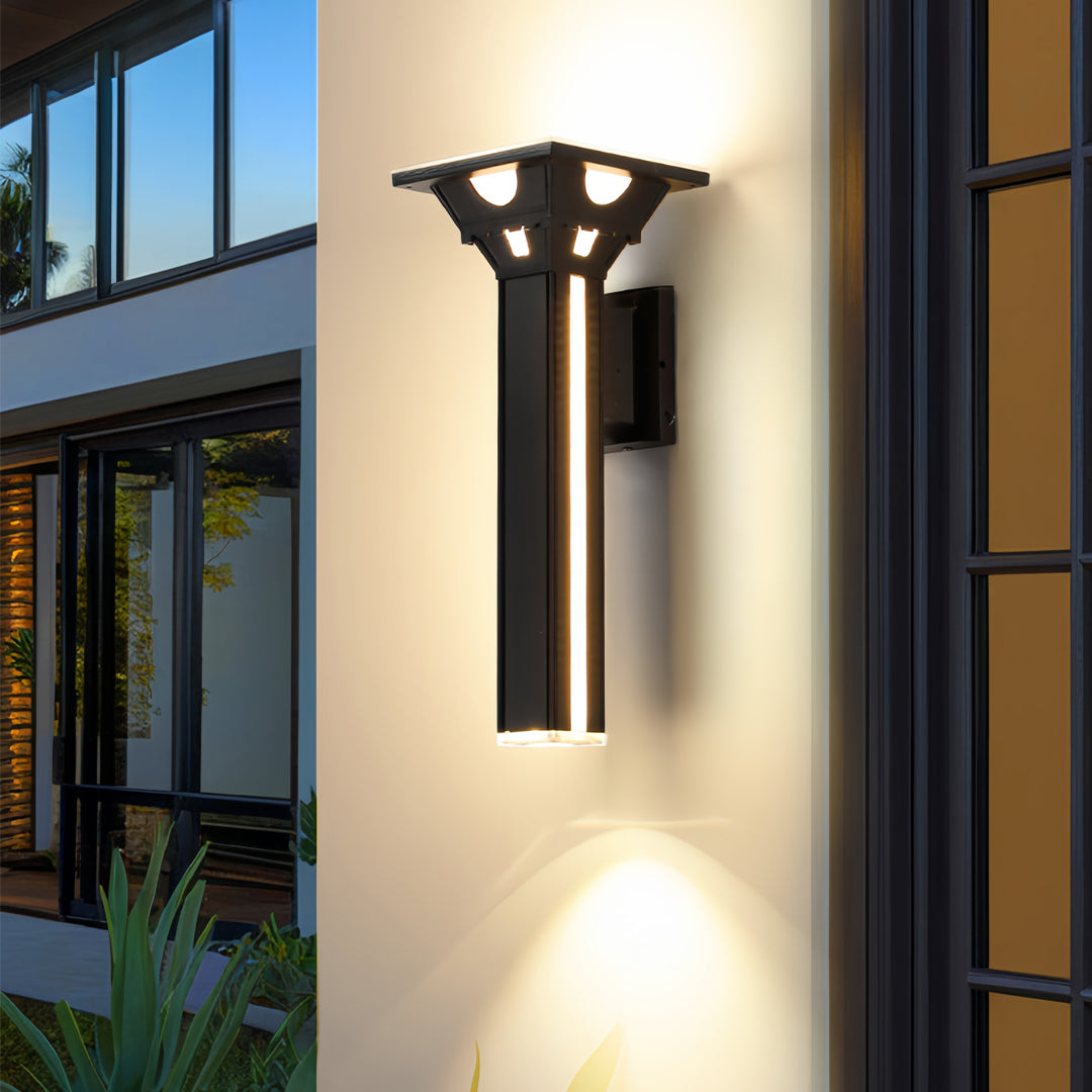 Outdoor wall column lights illuminating a garage exterior with warm lighting.