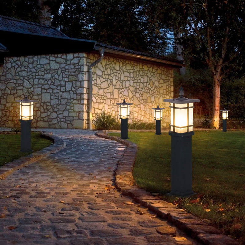Garden bollard lighting enhancing a contemporary outdoor entrance with warm light.