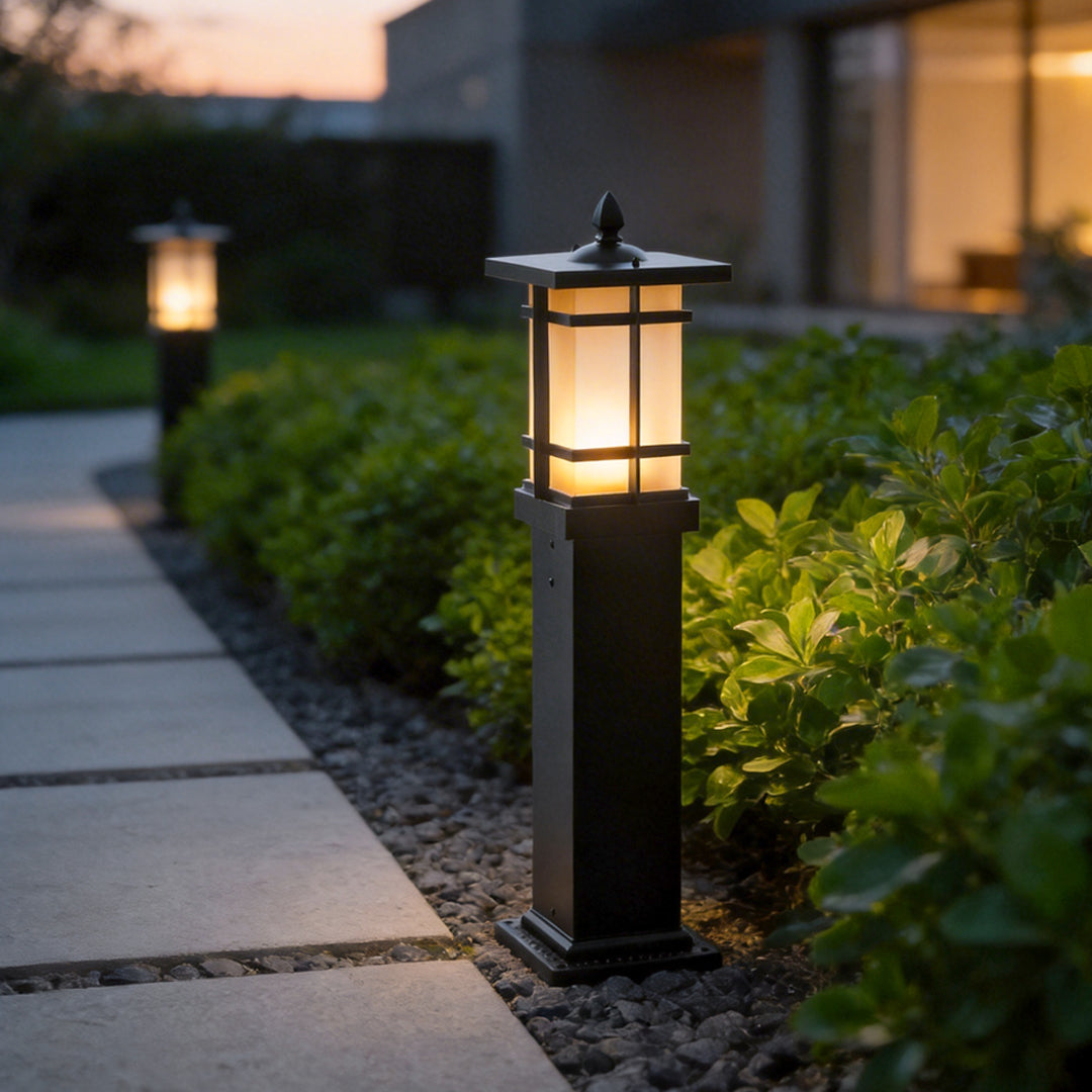 Garden bollard lighting enhancing a garden walkway with soft ambient light.