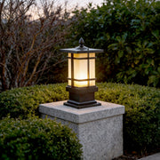 Garden bollard lighting illuminating a landscaped pathway with warm glow at dusk.