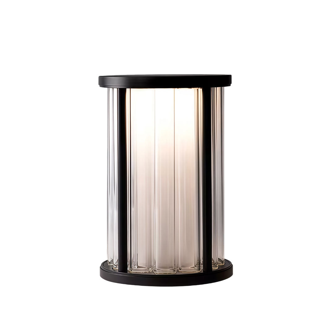 Garden bollard lighting with a modern design, placed on a concrete surface.