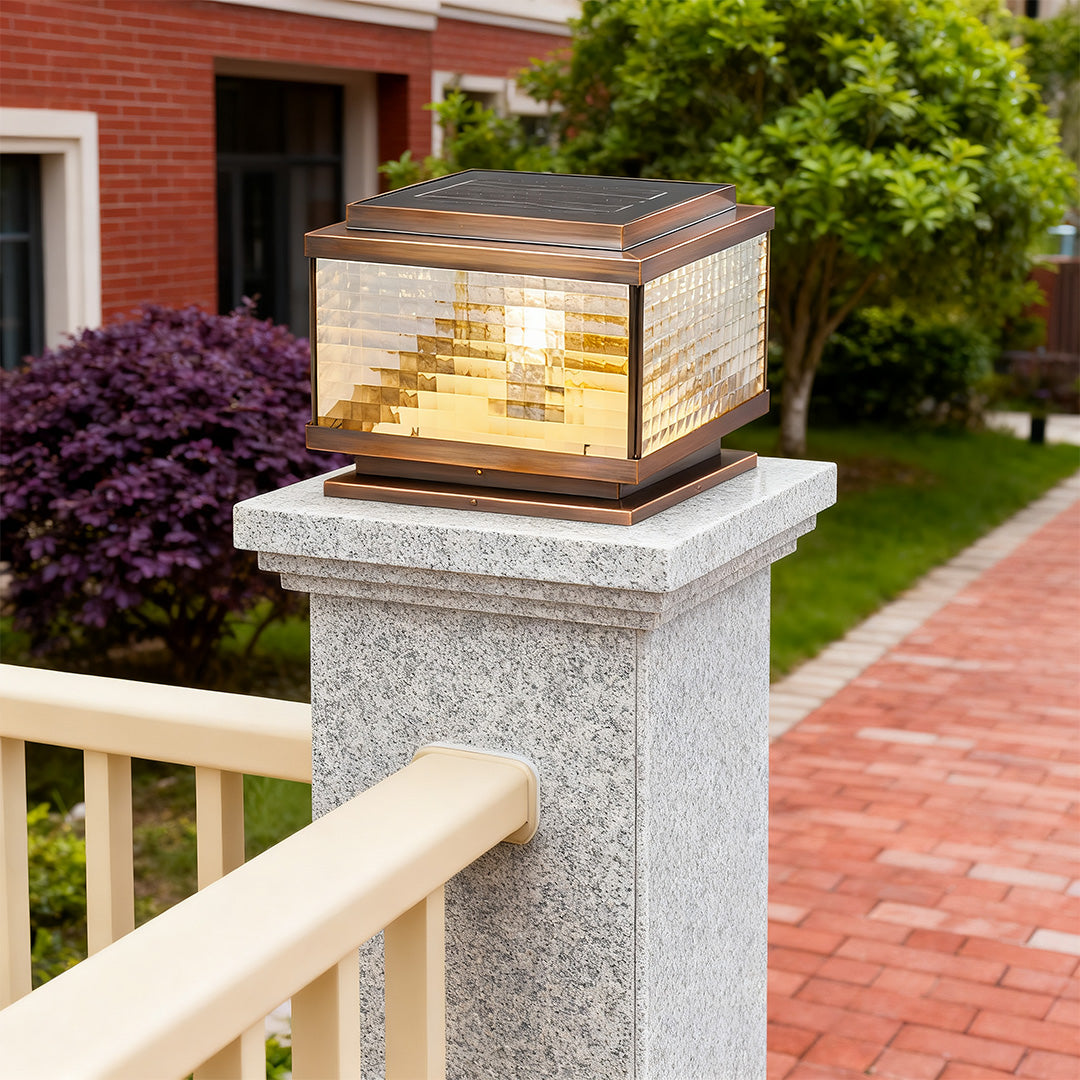 Pillar cap light installed on stone column at garden entrance creating inviting outdoor ambiance