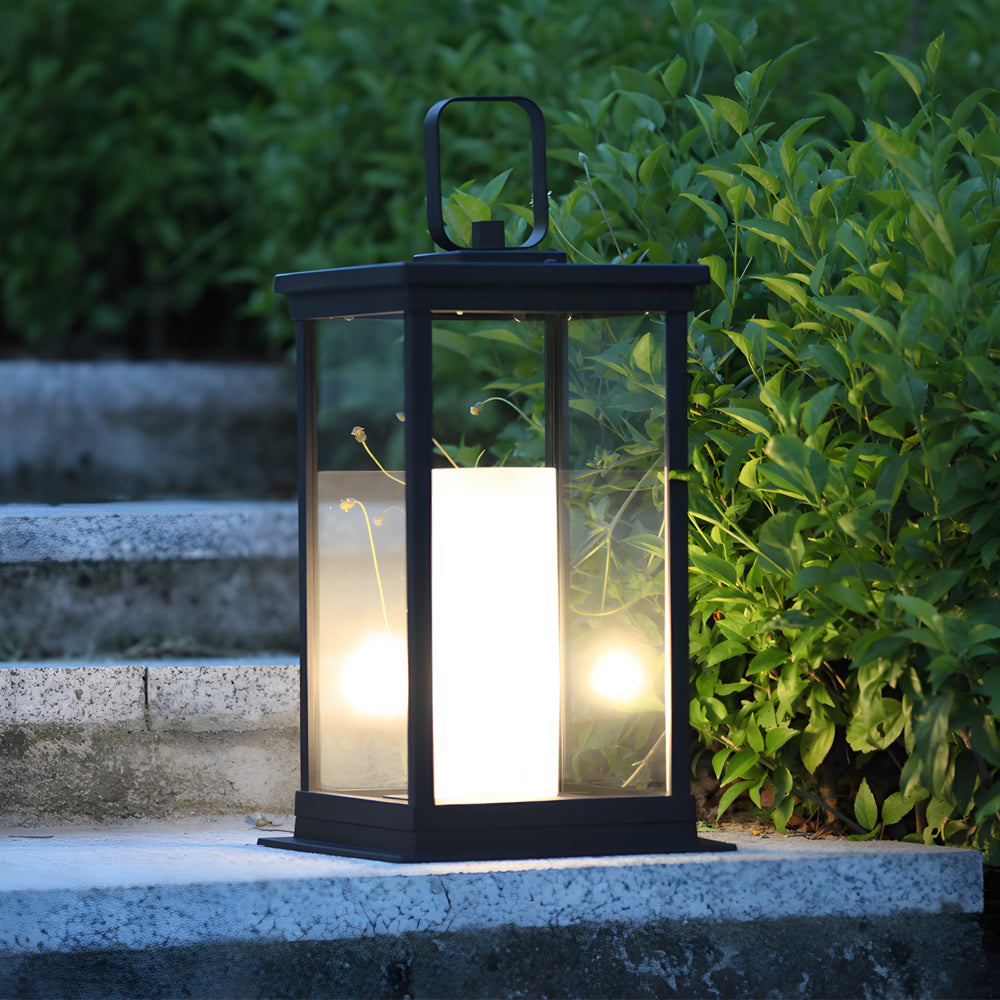 Silver Metal Table Lamp outdoor lantern illuminated in garden setting with warm LED lighting among green foliage