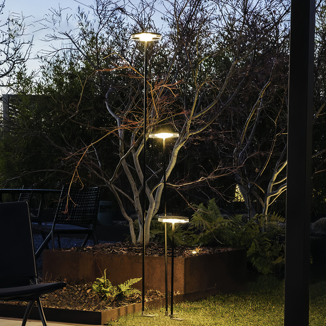Outdoor garden environment with integrated LED fixtures subtly shaping an inviting outdoor lighting path.
